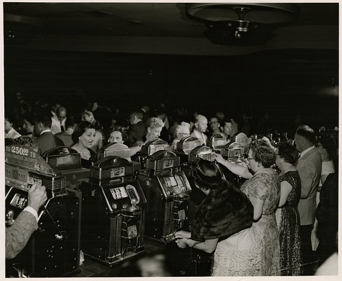 Photograph of slots players at the Sands Hotel and Casino, Las Vegas, circa late 1950s-early 1960s