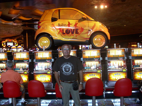 Jeffrey standing in front of The Beatles LOVE slots at The Mirage
